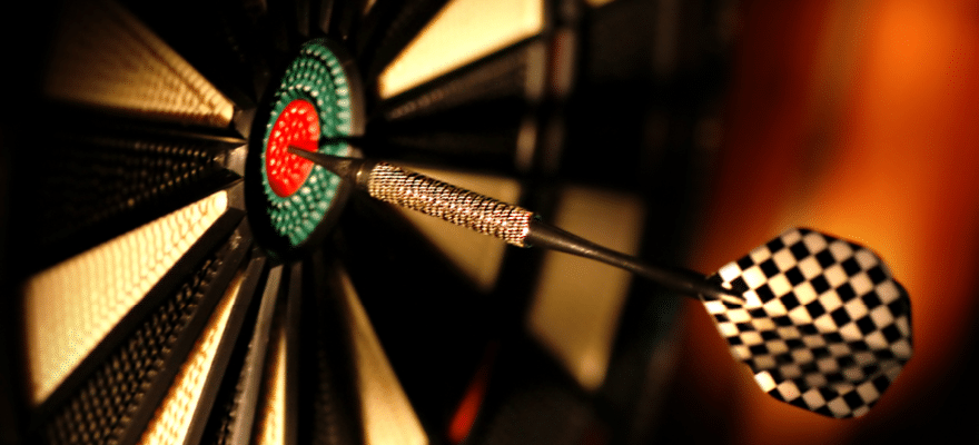 One arrow in the centre of a dart board in the bar