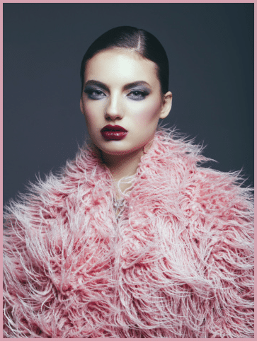 Young fashionable woman wearing pink faux fur coat  Professional make-up and hairstyle  High-end retouch 