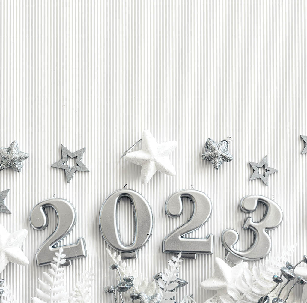 Christmas background with numbers 2023 on a textured white background with decor details, flat lay.