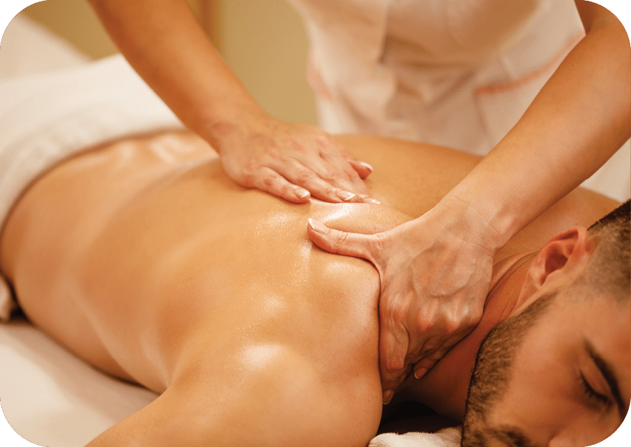 Close-up of man having back massage during spa treatment at wellness center. 