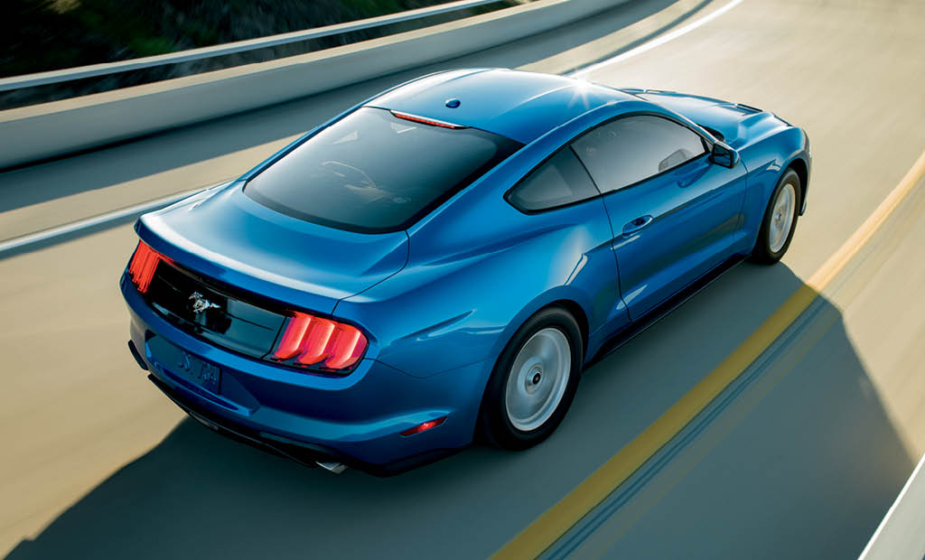 EcoBoost overhead rear in Velocity Blue with available equipment on twisty mountain road