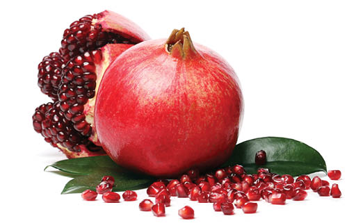 Delicious, exotic pomegranate fruit on white background