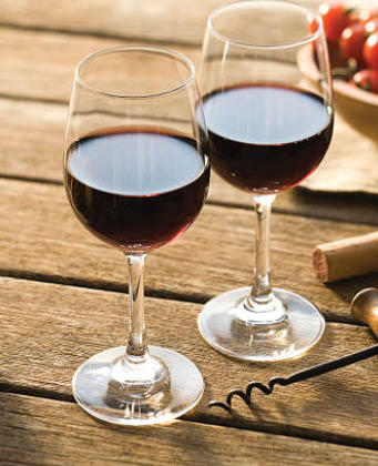 Red wine on picnic table on a summer's late afternoon 