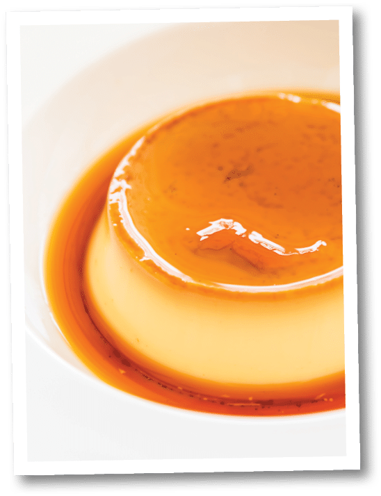 Caramel custard pudding in white plate - selective focus point