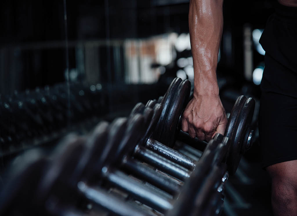 Young man in sportswear an exercise class in a gym