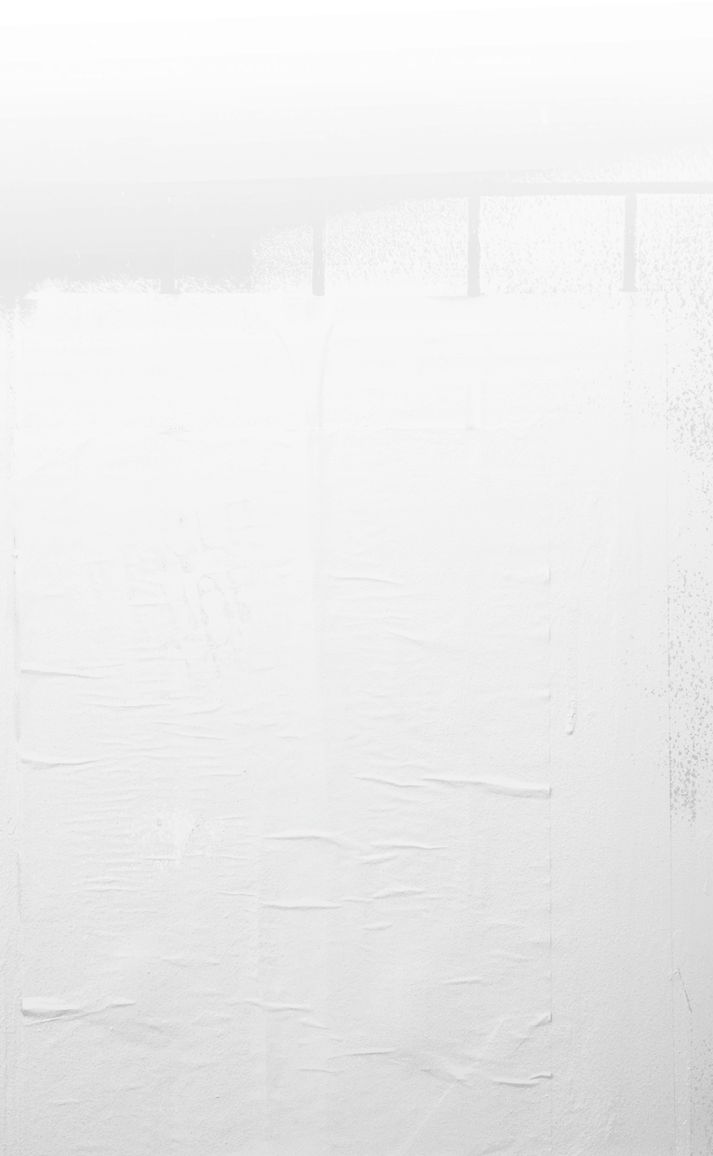 Rough white paint rolled over a black wooden textured background