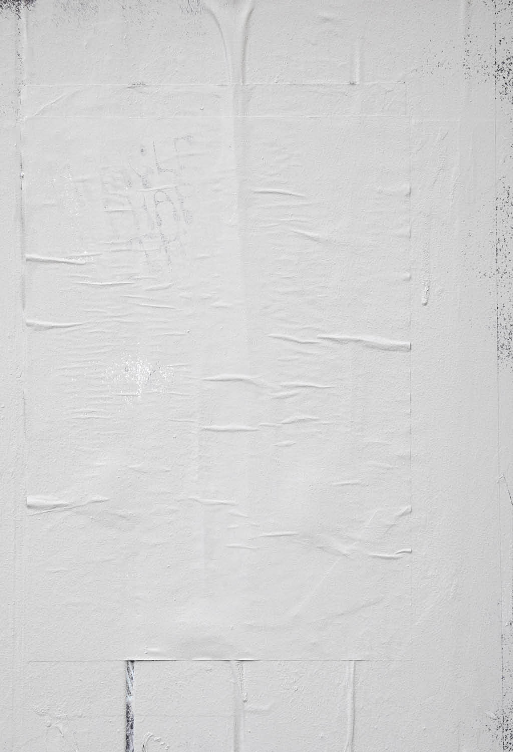 Rough white paint rolled over a black wooden textured background