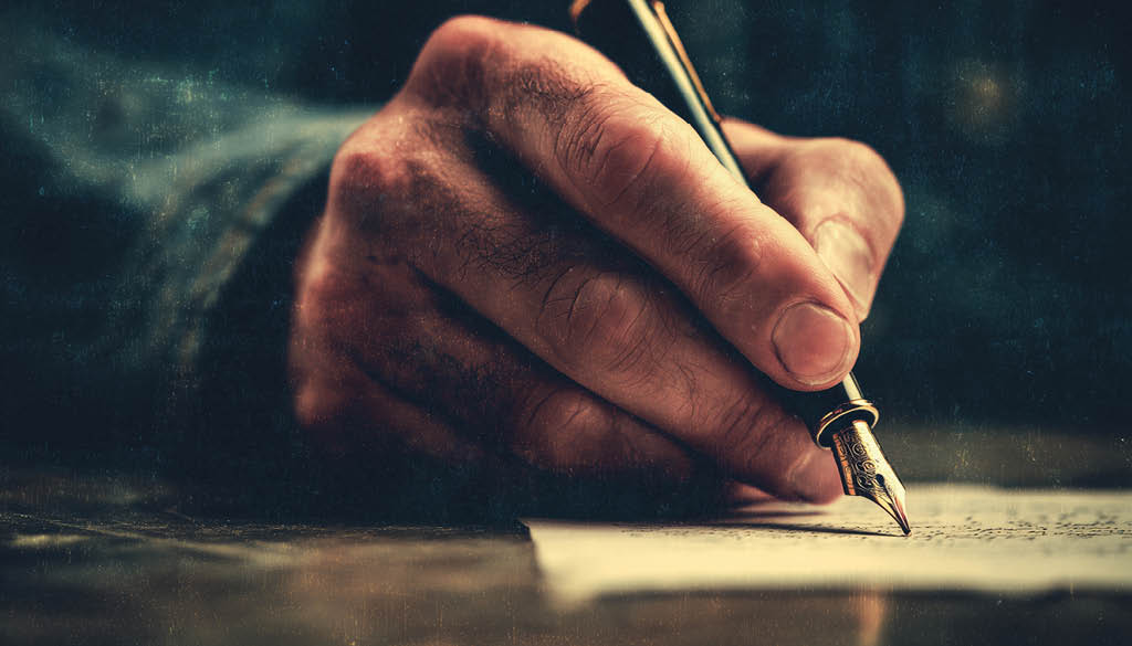 Faded And Toned Retro Image Of A Man Writing A Note With A Fountain Pen Rendered With Vintage Effect