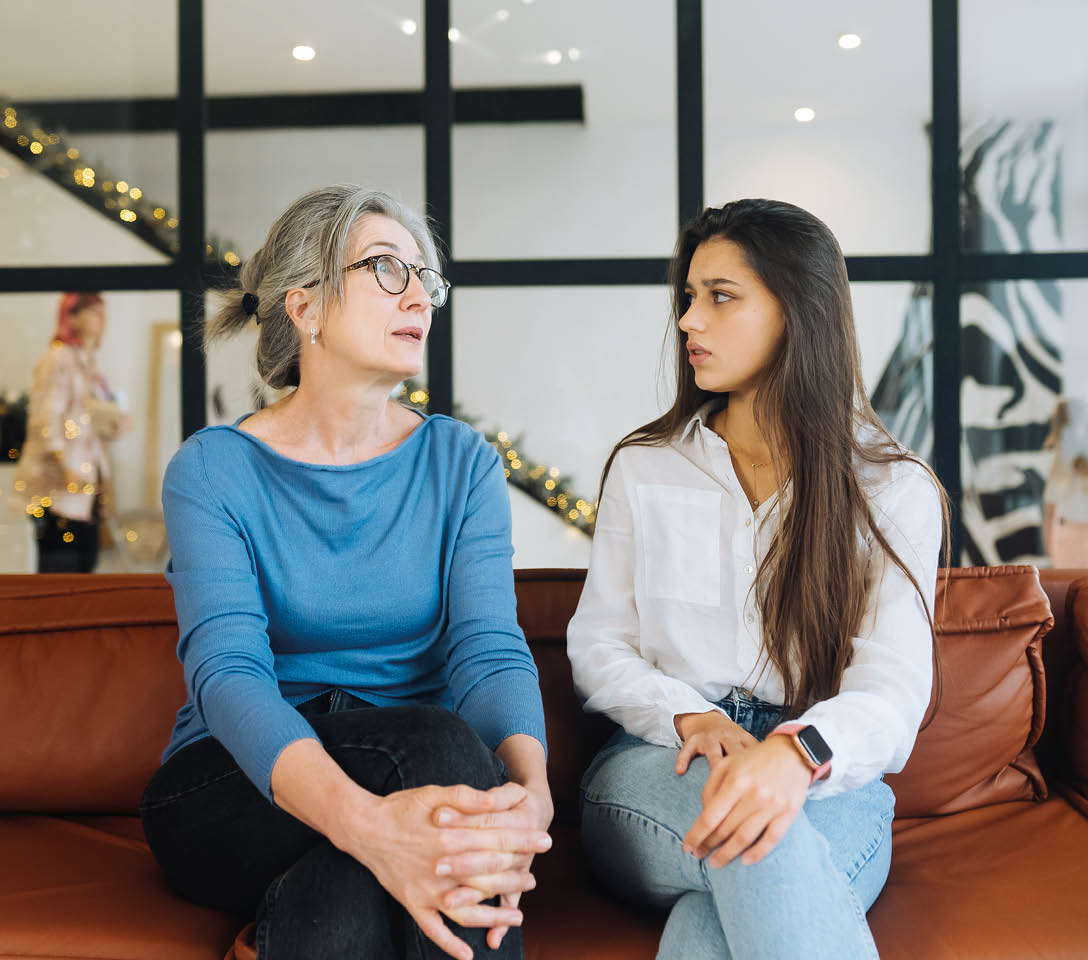 Young woman visiting grandmother at home